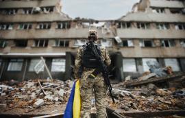 Ukrainian military woman with the Ukrainian flag 