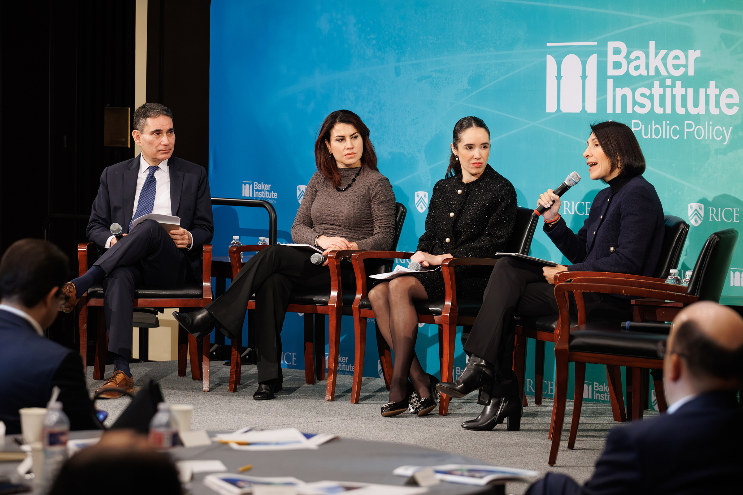 Tony Payan and panelists in discussion onstage at Baker Hall