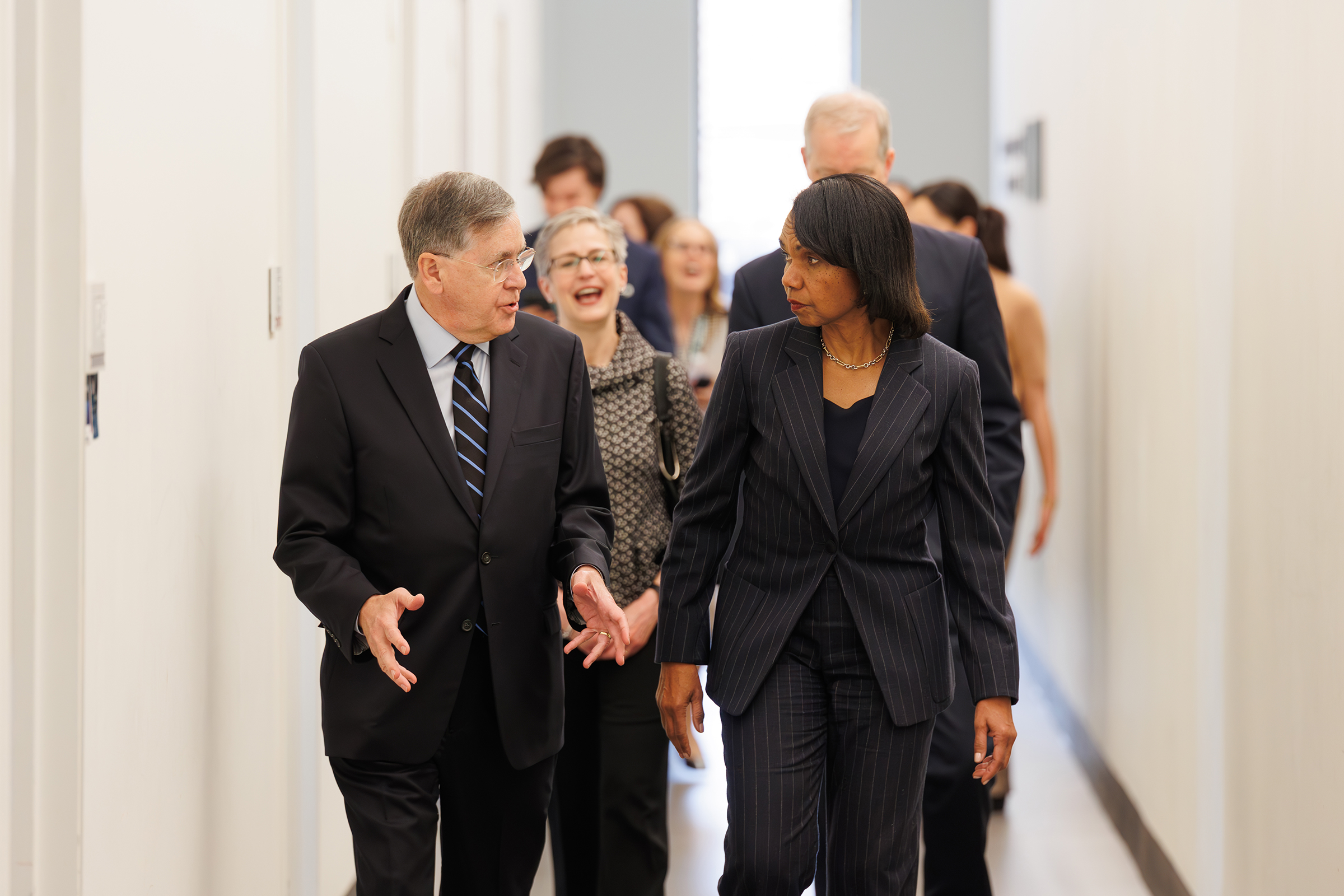 Baker Institute Director David Satterfield and former Secretary of State Condoleezza Rice walking together