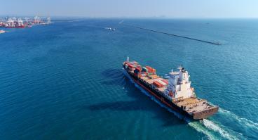  Aerial view container ship going to sea port for import export