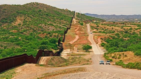 Border Fence beside a road near Nogales, Arizona 